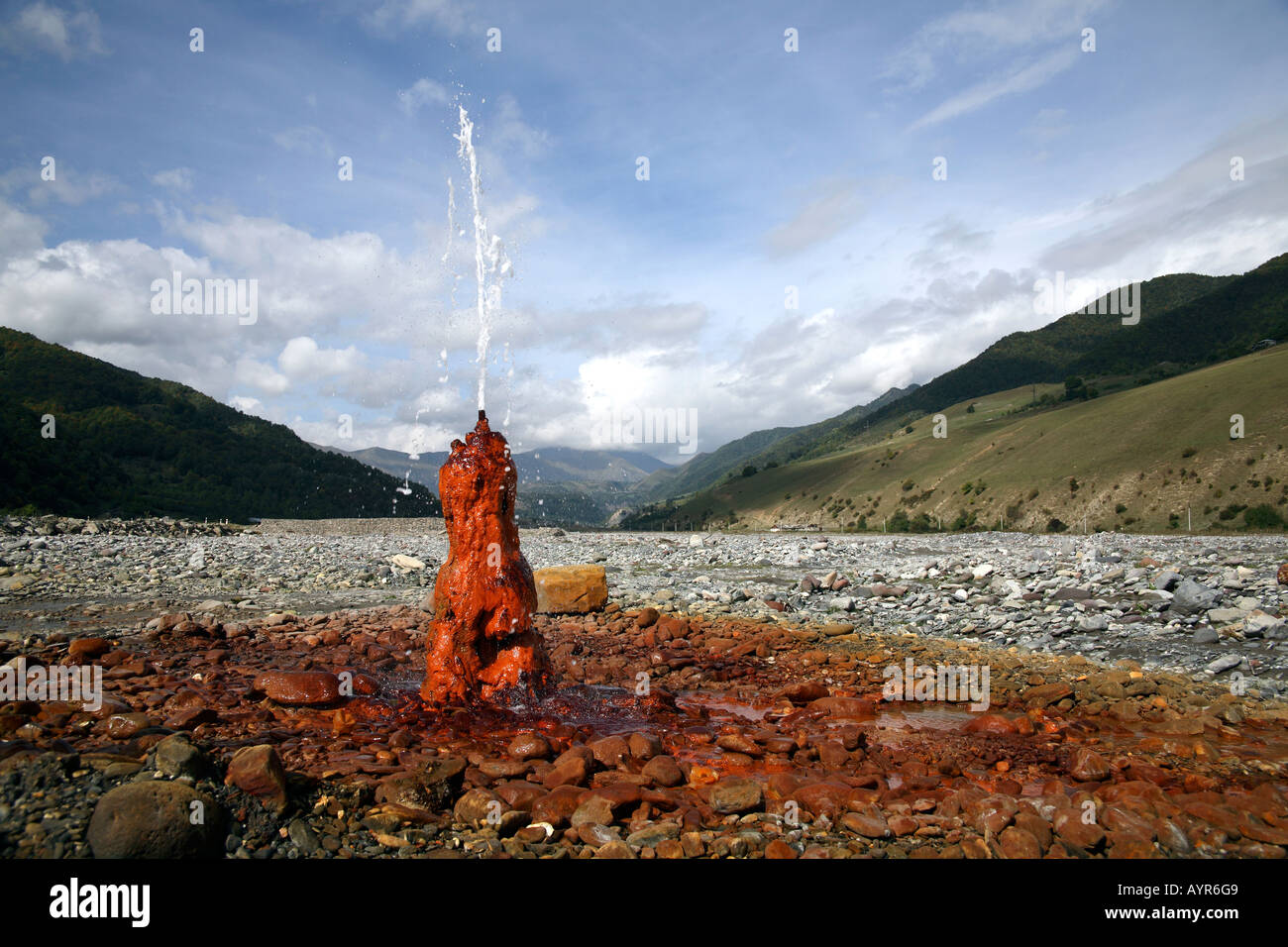 Mineral water spring staining the surrounding rocks rust colour. Jvari ...