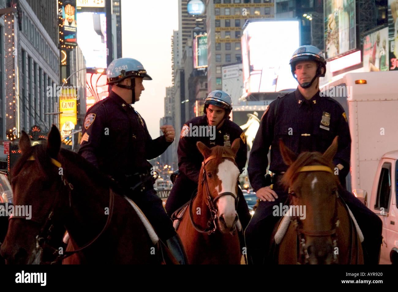 MOUNTED NYPD POLICE AMONGST THE TRAFFIC AT TIMES SQUARE IN MIDTOWN ...