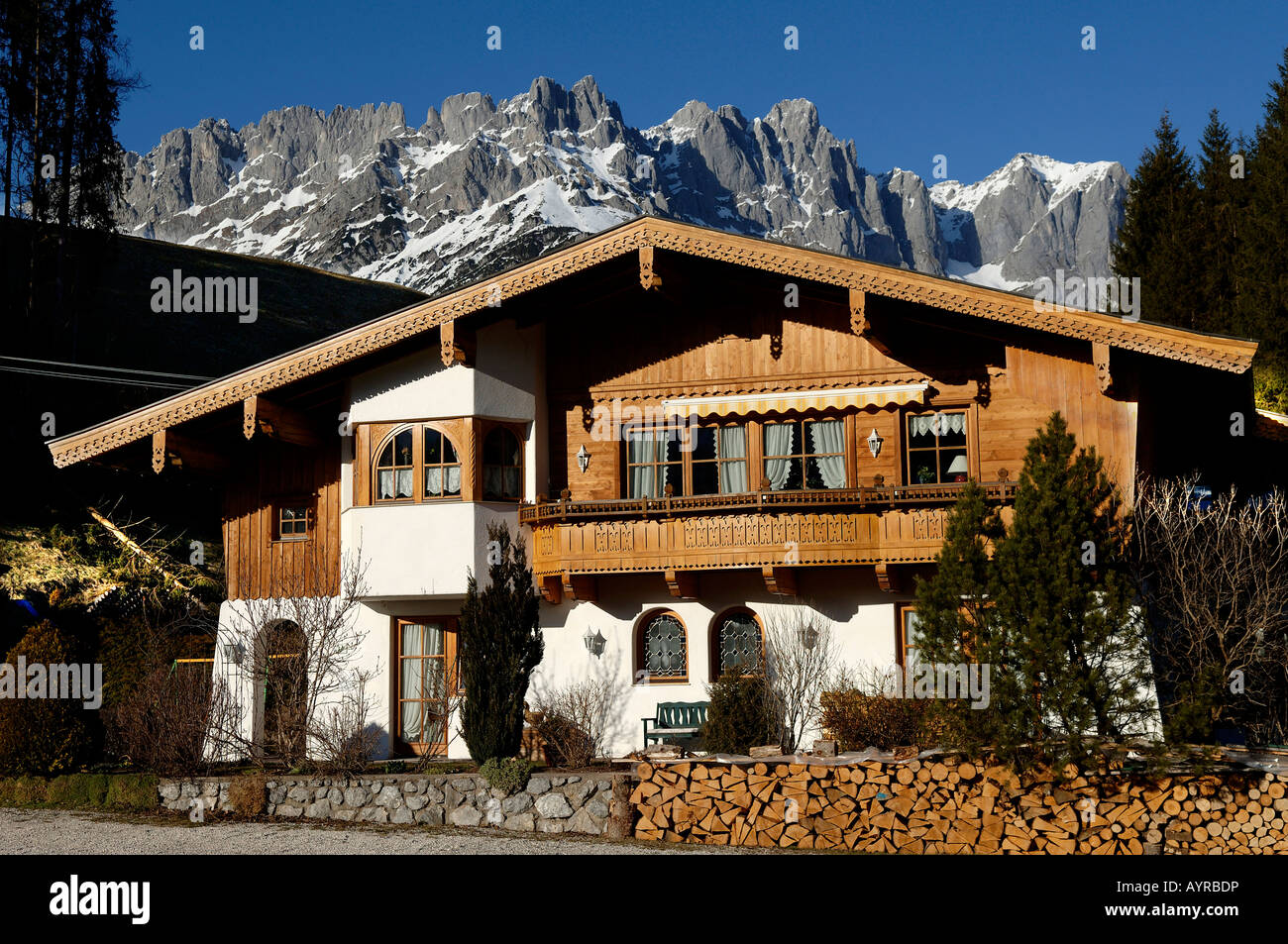 Tirolean-style house and the Wilder Kaiser Range, Going, Tirol, Austria, Europe Stock Photo