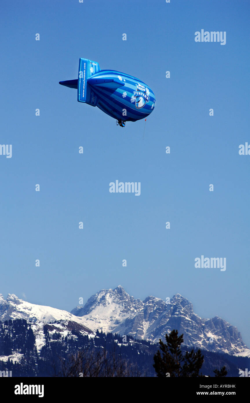 Zeppelin (blimp) over the Alps near Going, Tirol, Austria, Europe Stock Photo