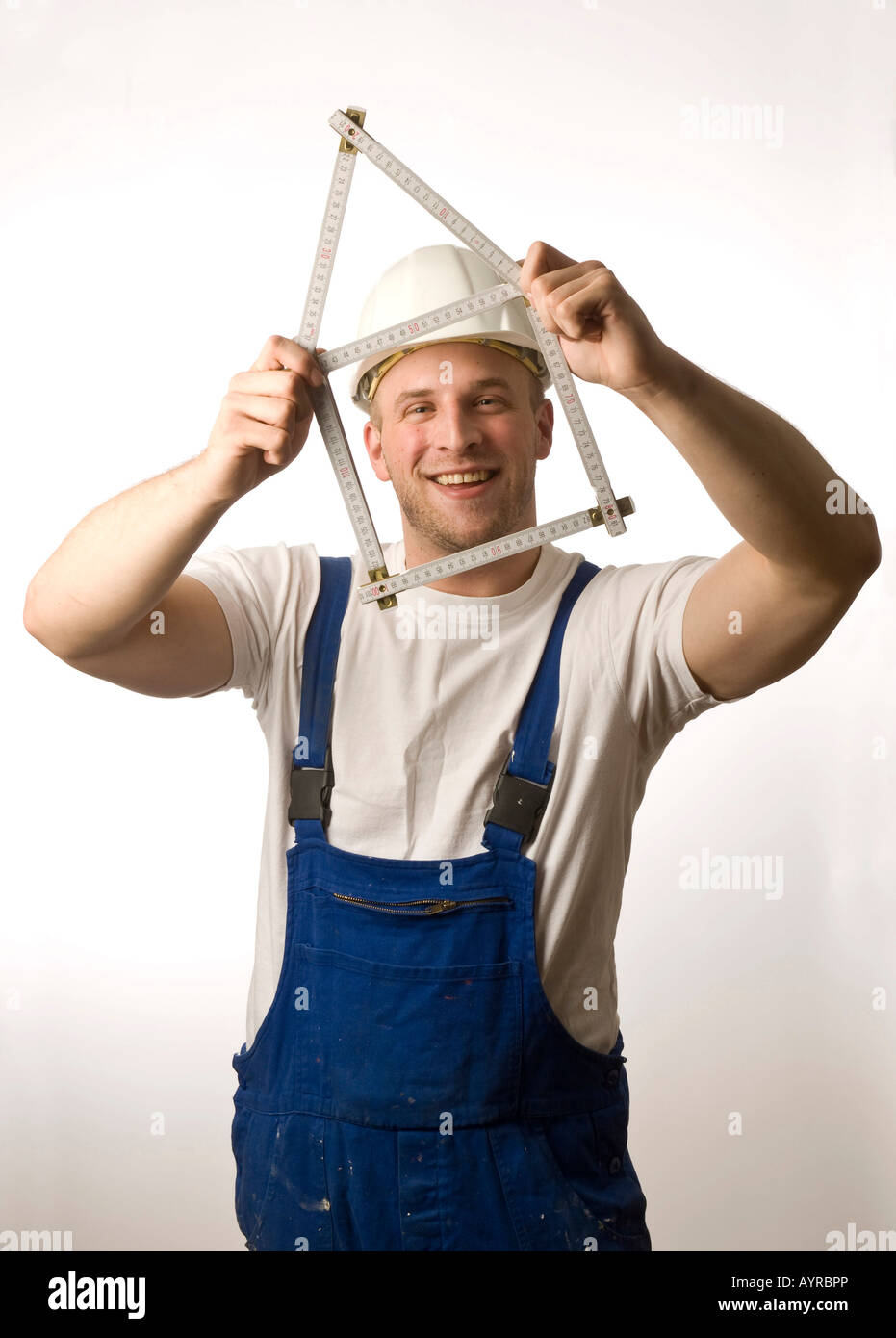 Construction holding folding rule yardstick hires stock photography
