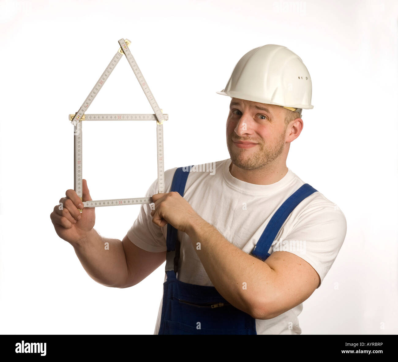 Construction worker holding folding rule (yardstick Stock Photo Alamy