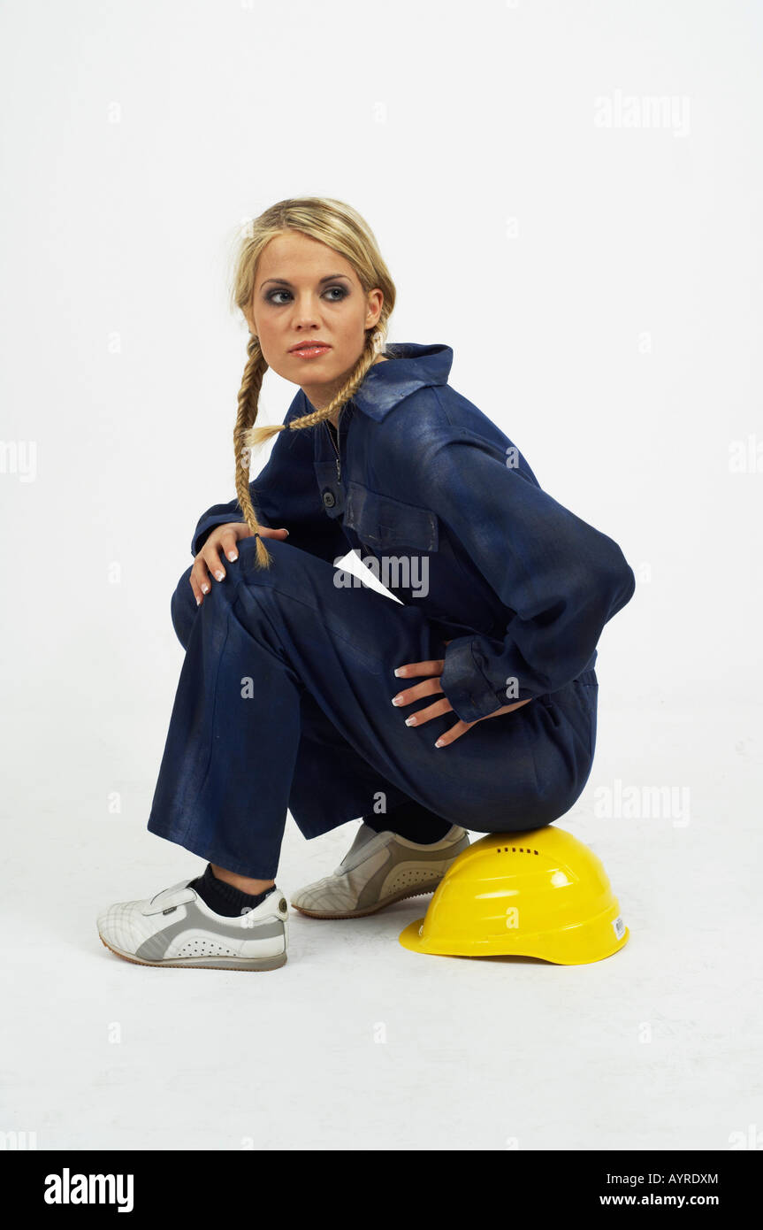 Young female construction sitting on her hardhat Stock Photo