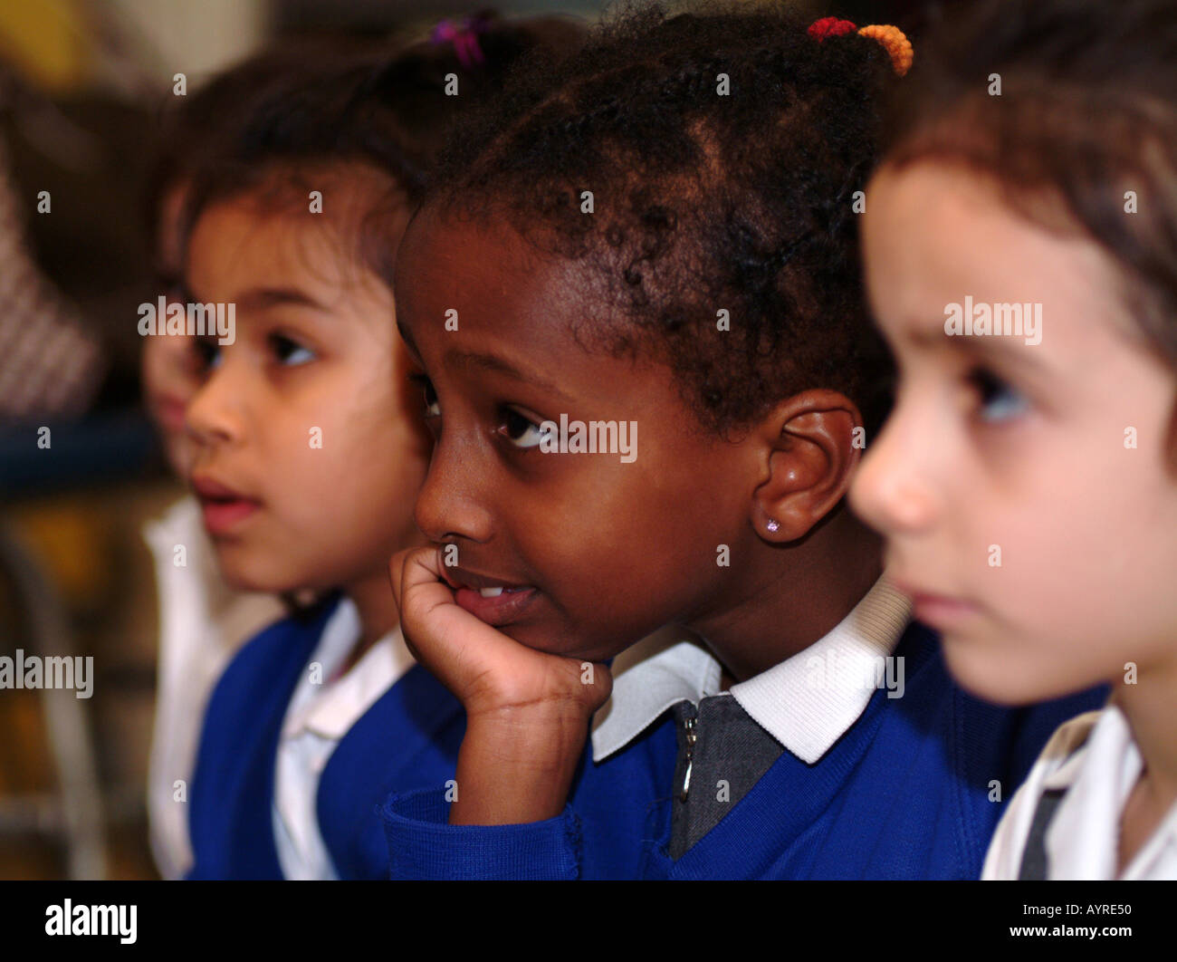 Youngsters at an after school club watching tv London UK Stock Photo