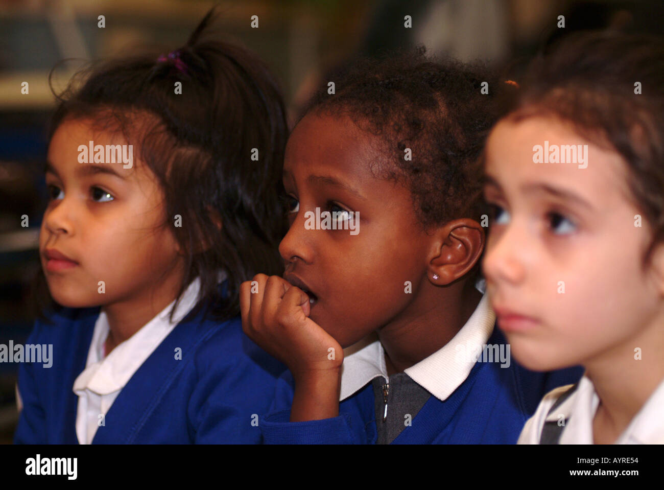 Youngsters at an after school club watching TV, London, UK. Stock Photo