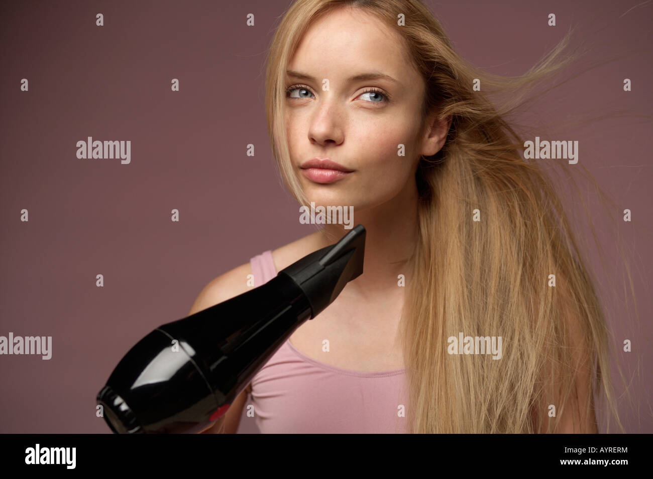 Woman drying her hair hi-res stock photography and images - Alamy