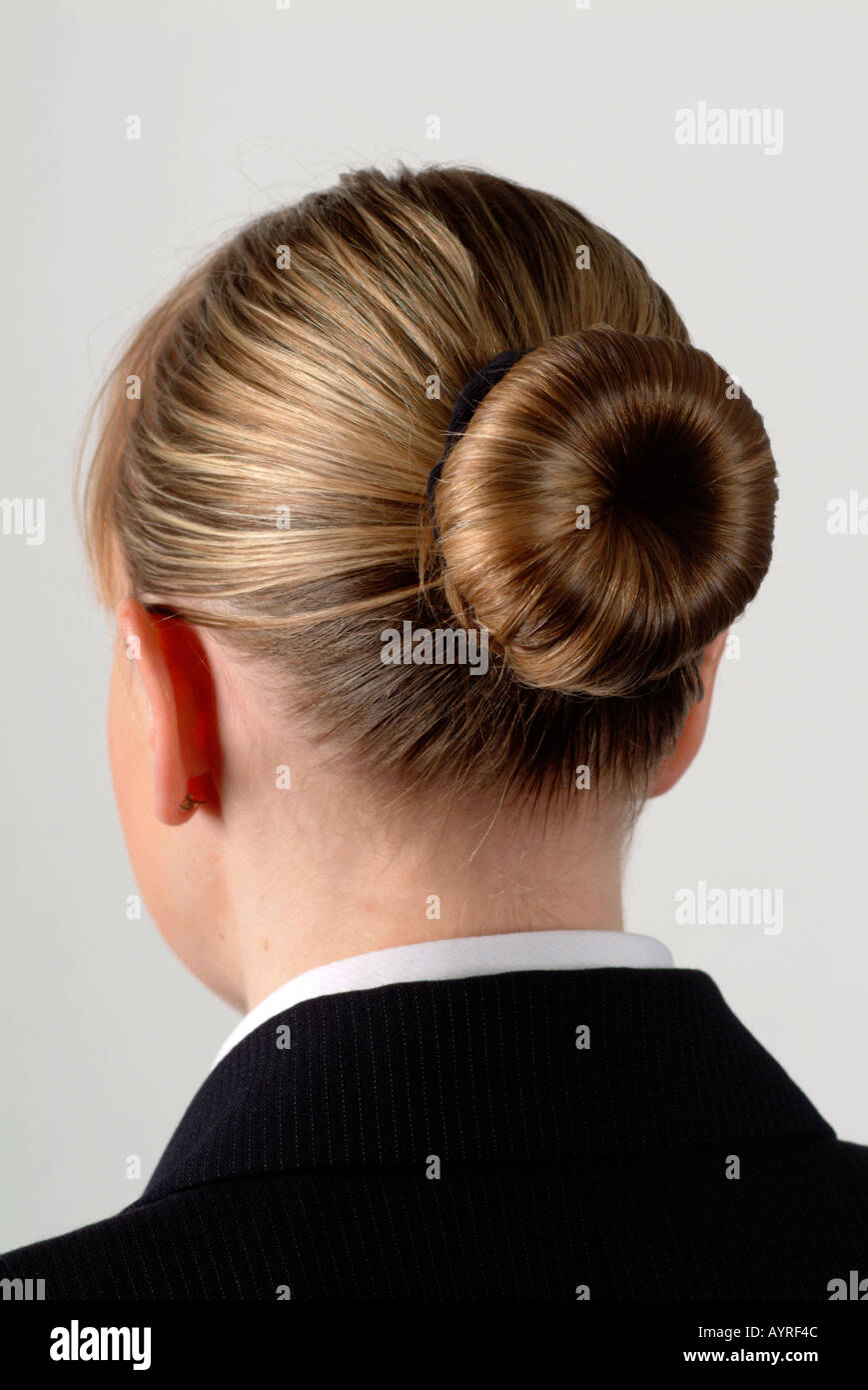 Young woman (cabin crew) with her hair in a bun, London, UK Stock Photo -  Alamy