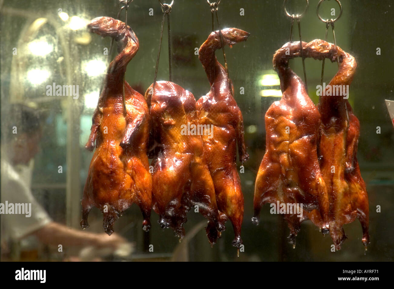 ROAST DUCKS HANGING IN WINDOW OF CHINESE RESTAURANT IN CHINATOWN SAN