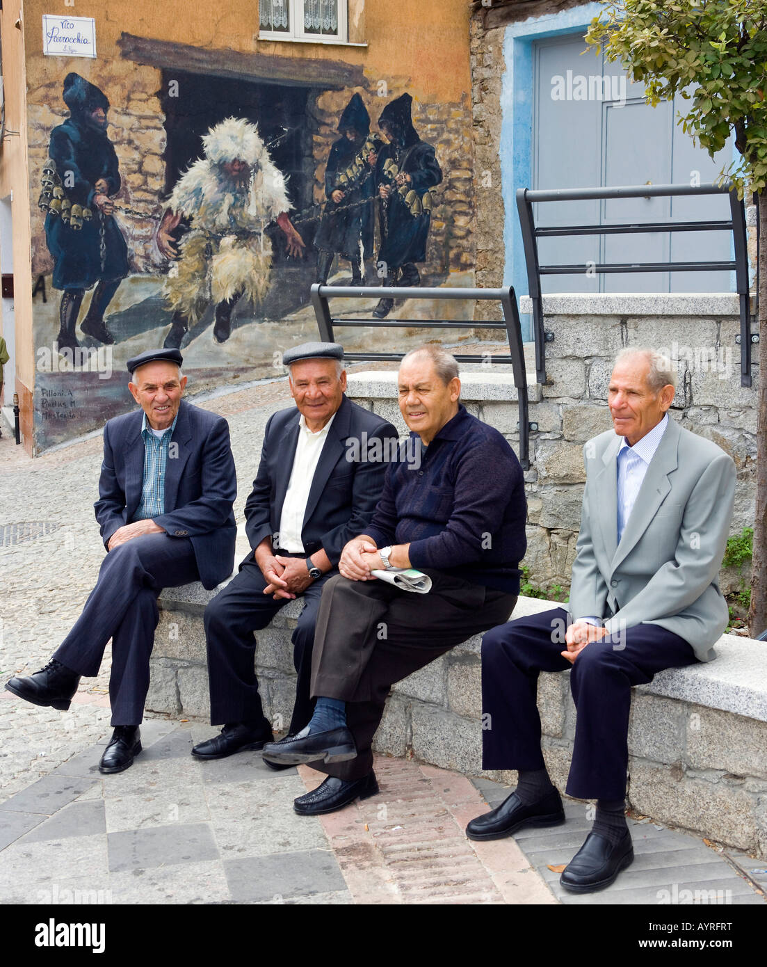 group-of-elderly-men-chatting-in-the-mountain-village-of-fonni-sardinia-AYRFRT.jpg