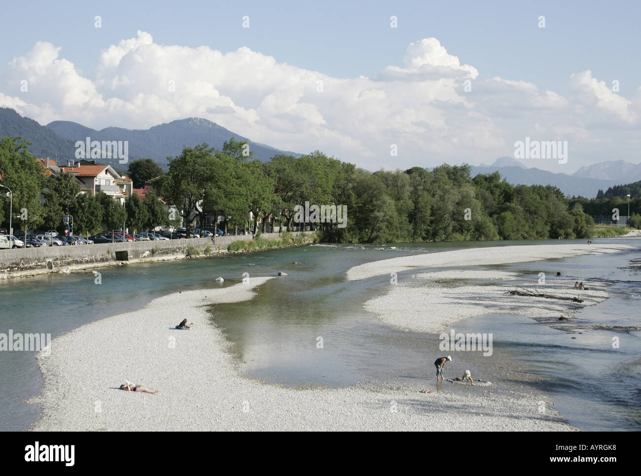 People sunbathing on the river bank of the Isar in Bad Toelz,Bavaria. Stock Photo
