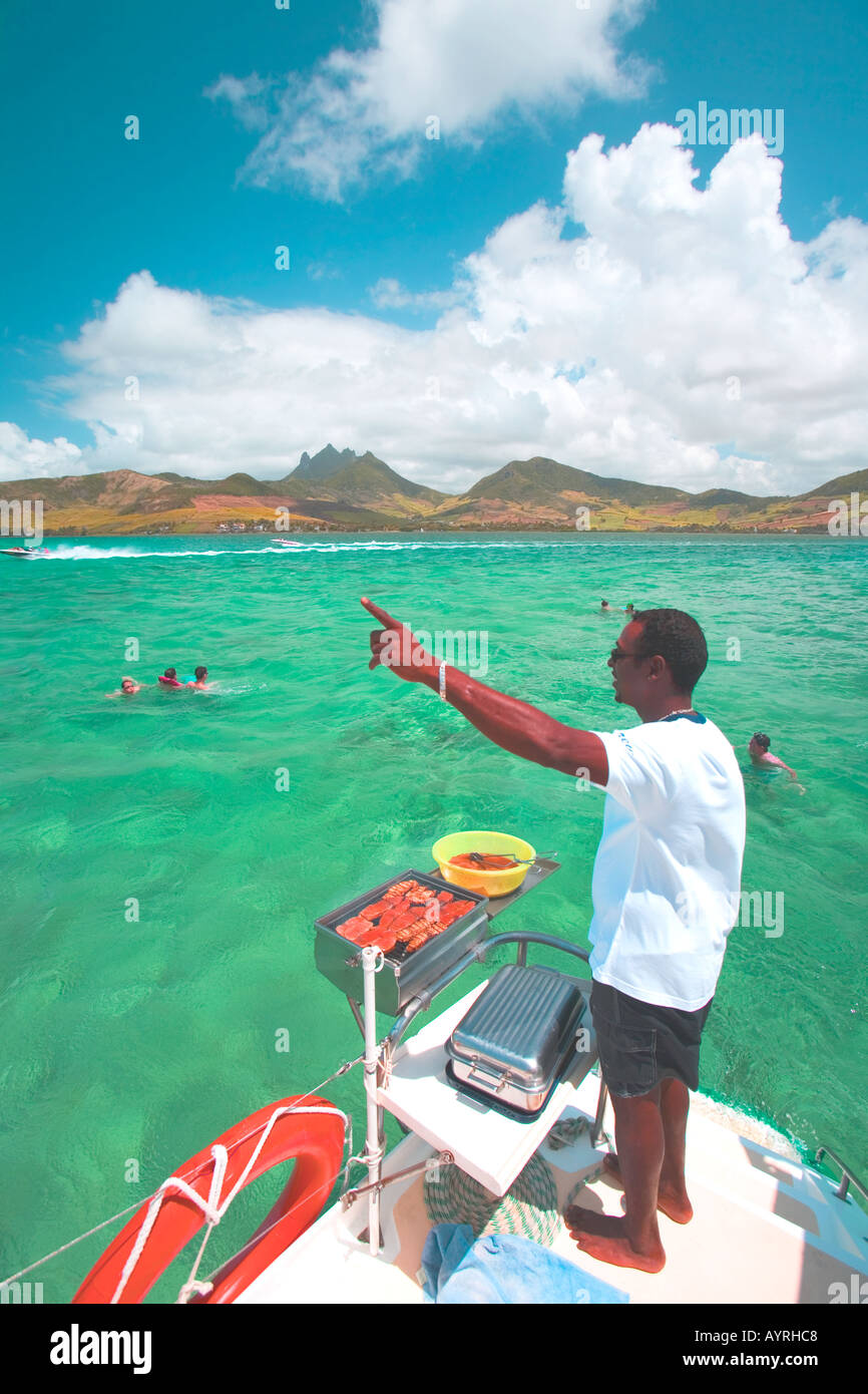 BBQ chefs gives snorkeling instructions Mauritius Stock Photo Alamy
