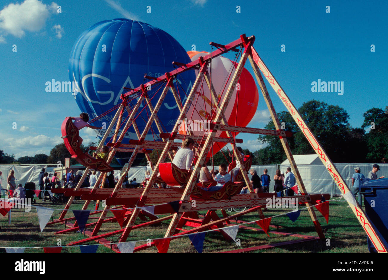 Swingboats, at the funfair, Hampton Court Craft Fair, West London, UK Stock Photo