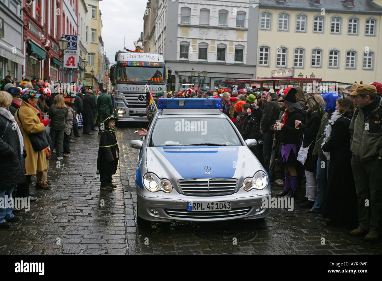 Police car at the front of the Shrove Monday Carnival procession in Koblenz, Rhineland-Palatinate, Germany, Europe Stock Photo