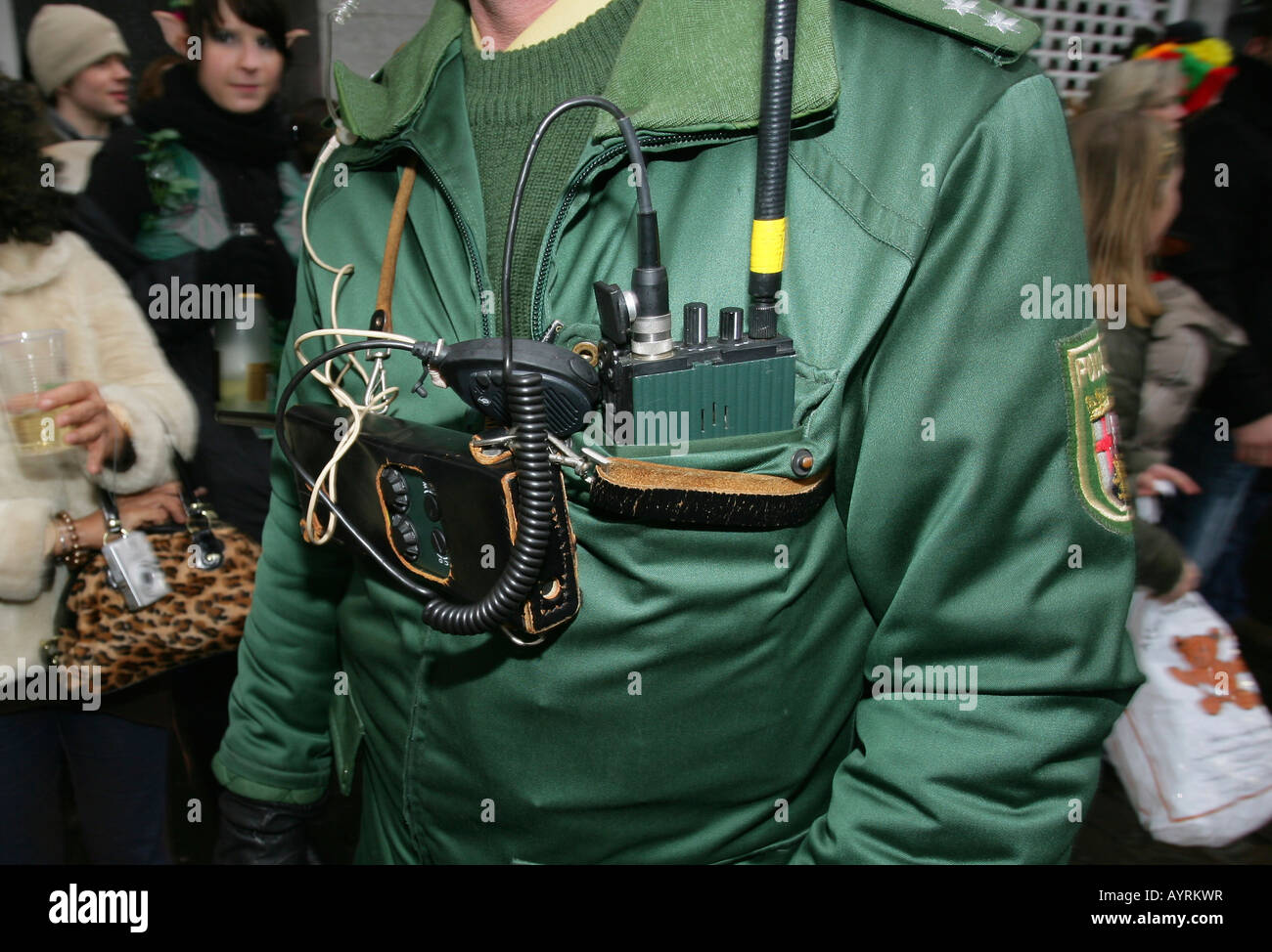 Police officer and dated radio equipment, Shrove Monday Carnival procession in Koblenz, Rhineland-Palatinate, Germany, Europe Stock Photo