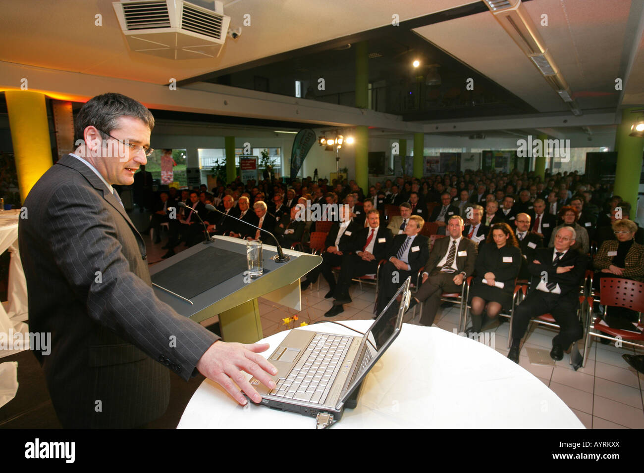 Rhineland-Palatinate Minister for Economic Affairs Hendrik Hering giving a presentation with laptop at an economic summit in Ko Stock Photo
