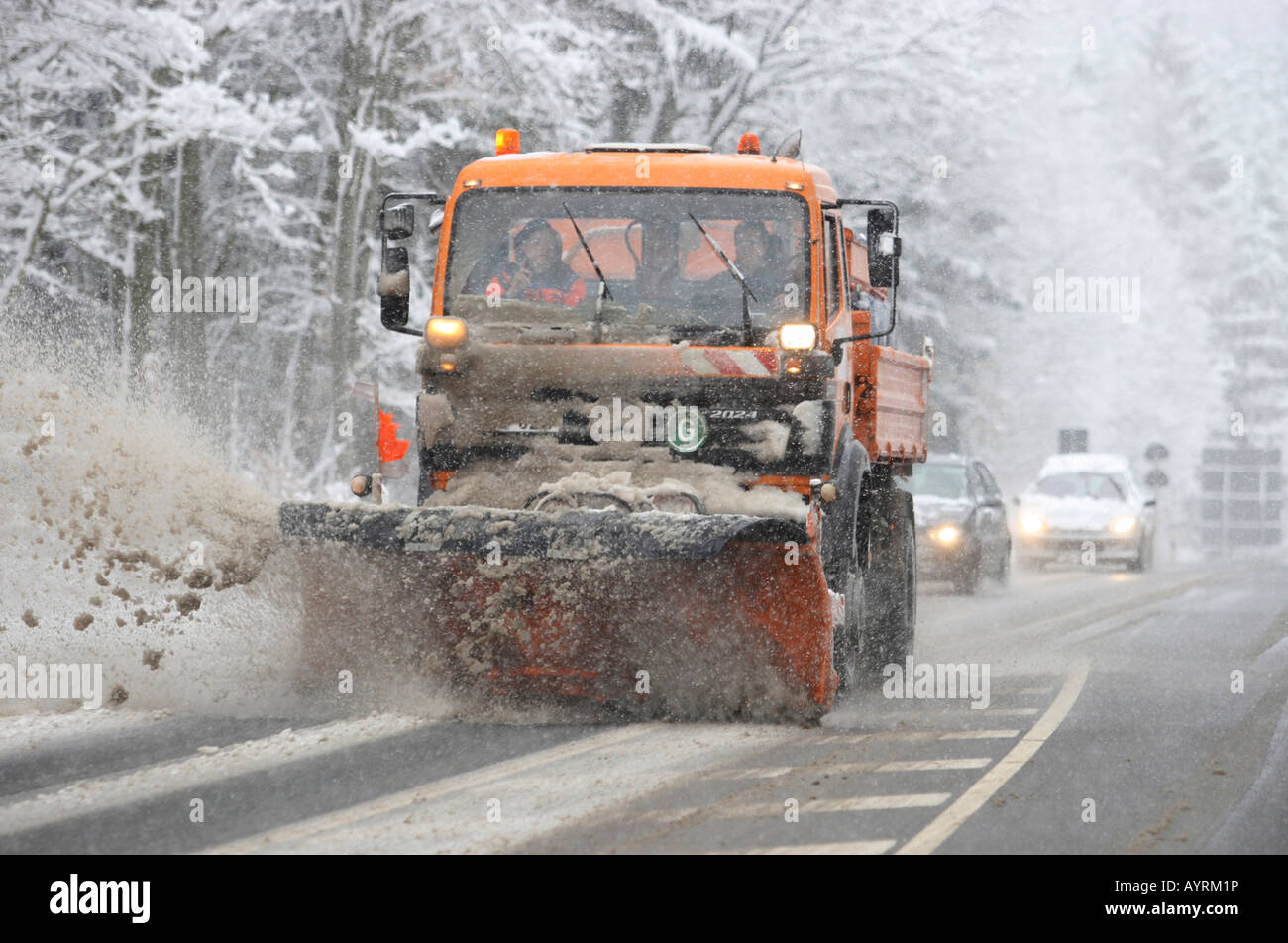 Snowplough clearing a highway in Germany, Europe Stock Photo