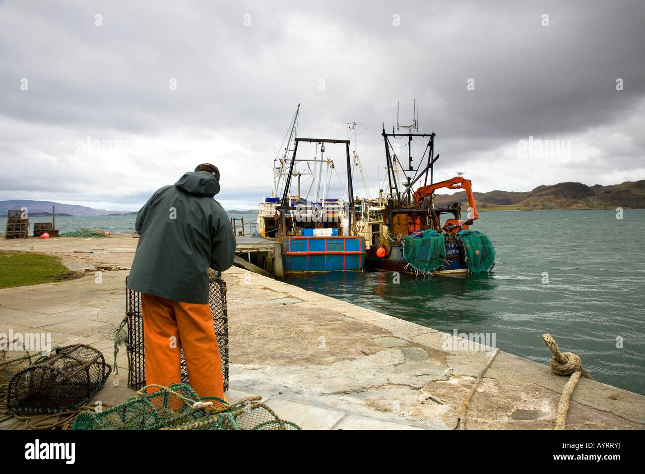 Herring Fisherman at Crinan 18th century harbour and canal on the  western coastline of Scotland. Stock Photo