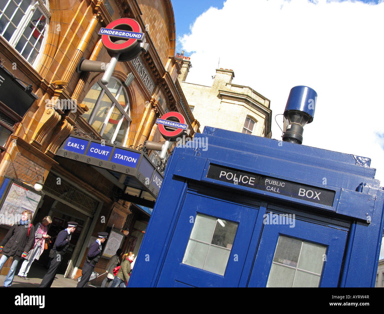 LONDON, UK. Old-fashioned blue police telephone box outside Earl's Court Road underground station. Stock Photo