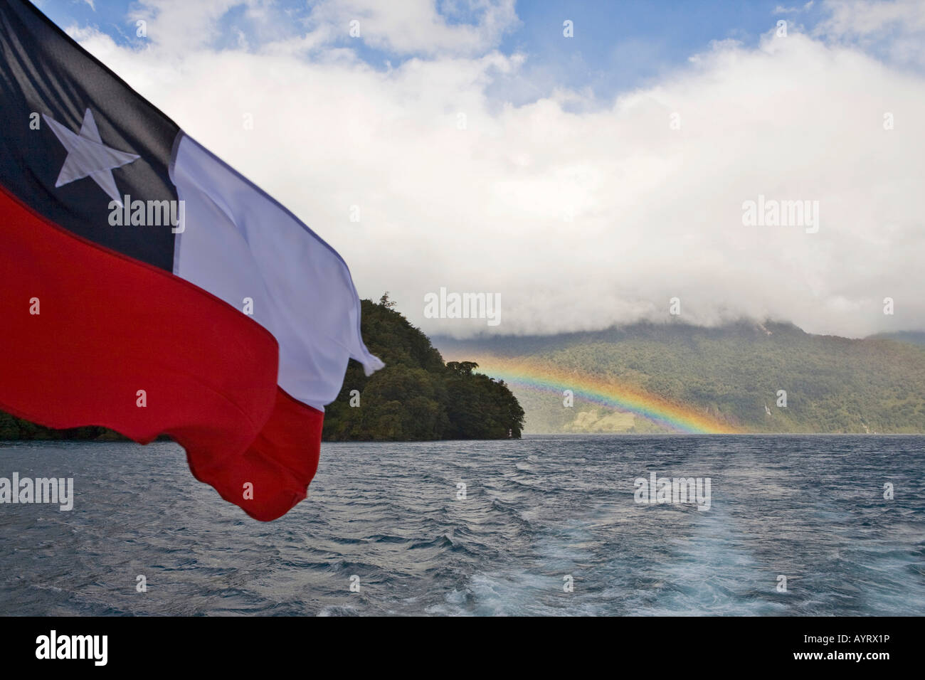 Chilean flag and rainbow, Lago Todos los Santos (All Saints' Lake), Vicente Pérez Rosales National Park, Región de los Lagos (L Stock Photo