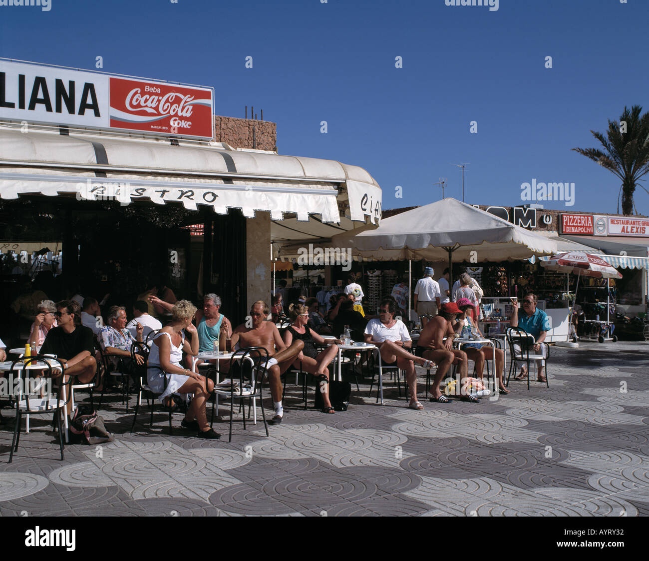 Spain, Gran Canaria, Canary Islands, E-Maspalomas, E-Playa del Ingles, tourists sitting in sidewalk cafes Stock Photo