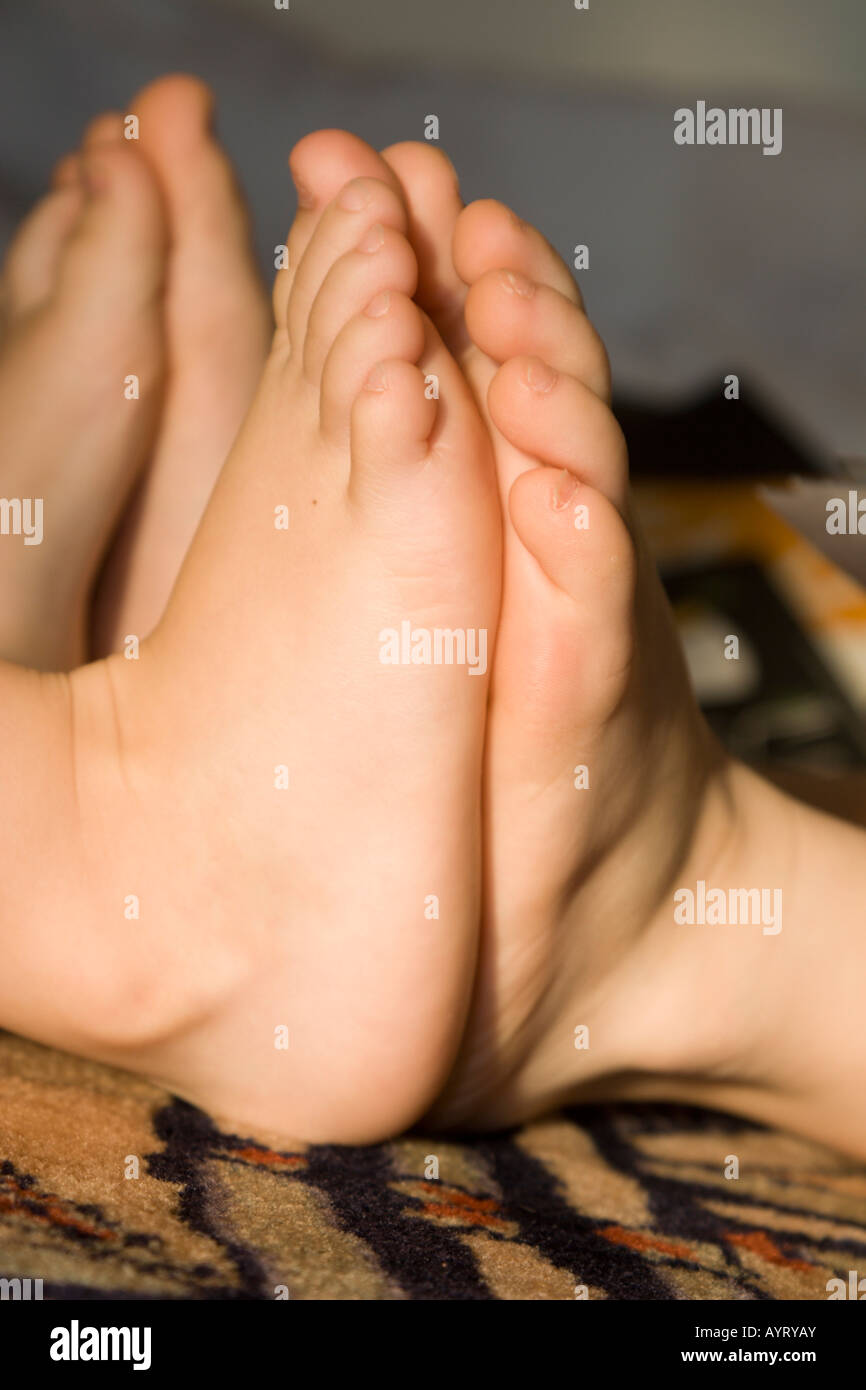 Children's feet pressed up against each other Stock Photo