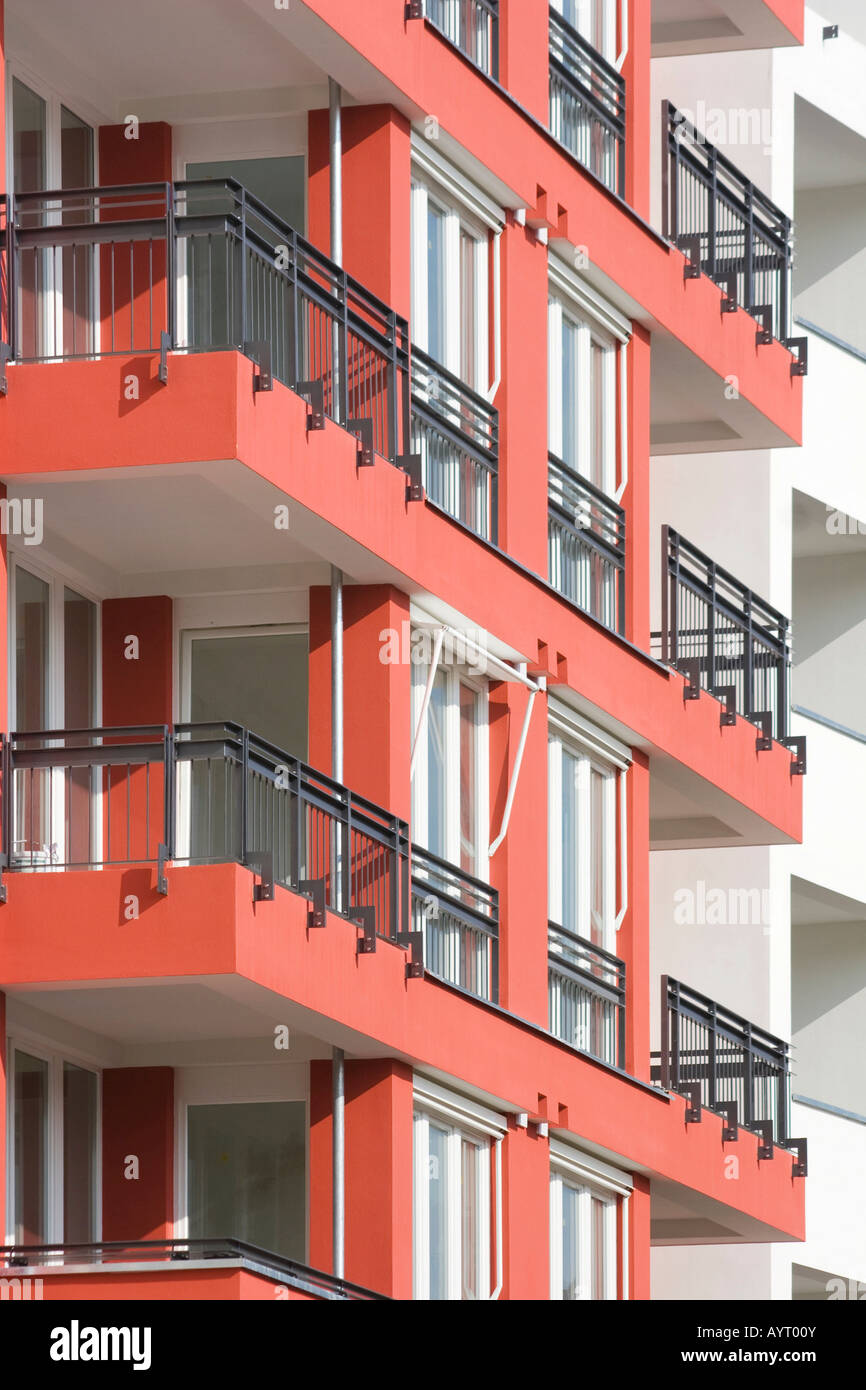 Red apartment building with balconies Stock Photo Alamy
