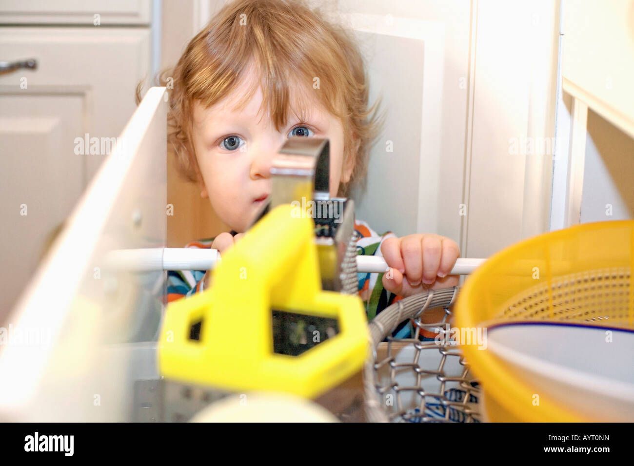 Boy Opening Drawer In The Kitchen Stock Photo 17172992 Alamy