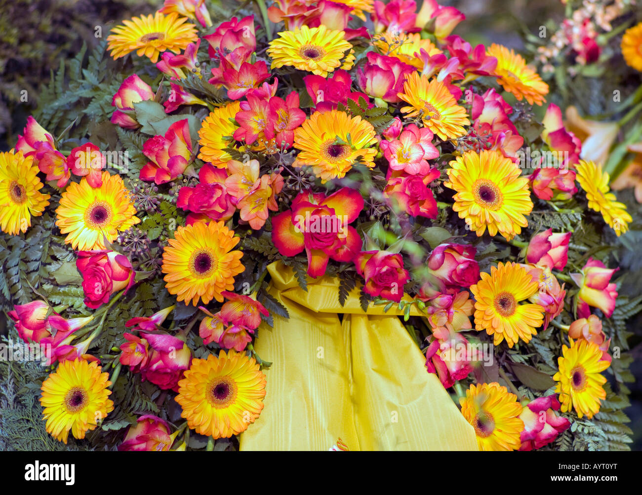 Fresh grave decorated with countless flowers at a cemetery in Germany Stock Photo
