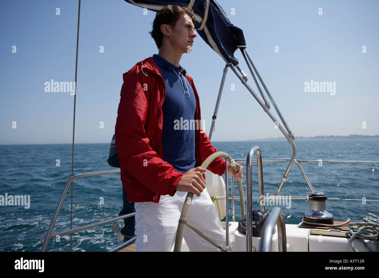Man steering a Boat Stock Photo - Alamy