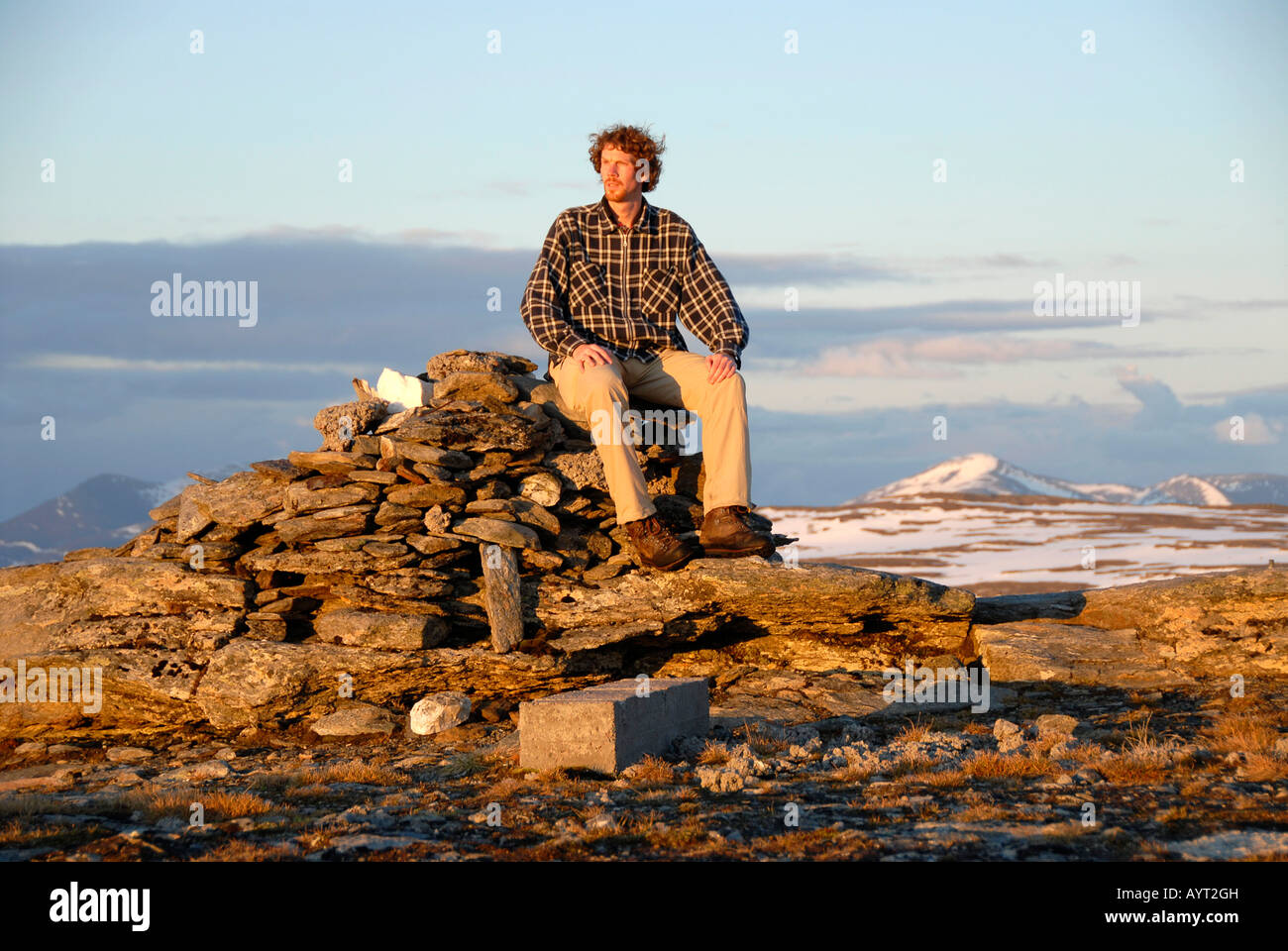 Lonely mountain climber on top of a mountain, Abisko National Park, Lapland, Sweden Stock Photo