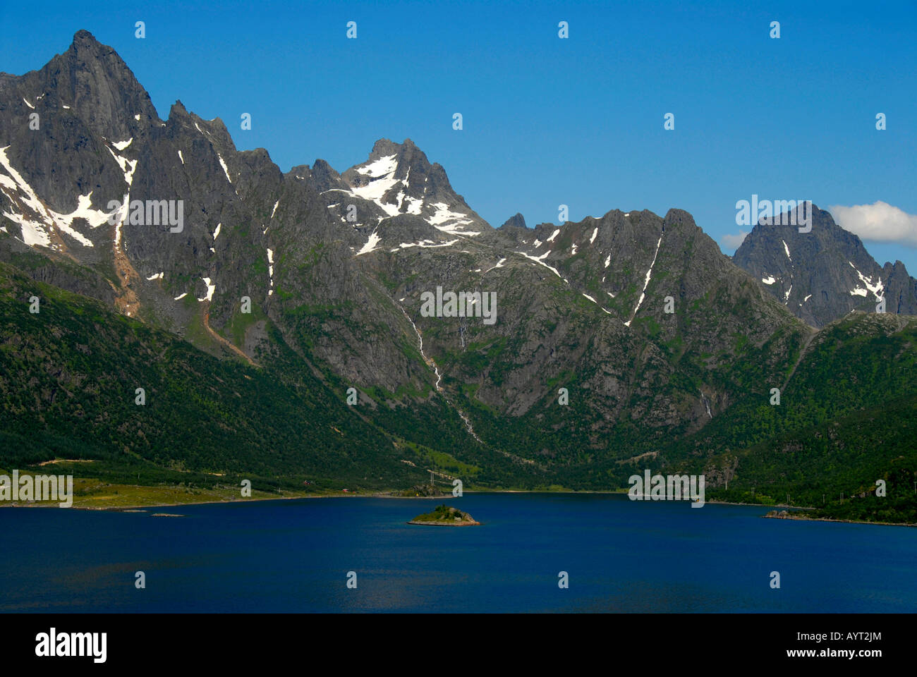 Steep, pointy rocky mountains at the end of a fjord, Lofoten, Norway Stock Photo