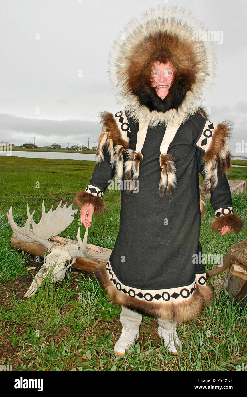 Visitor tries on Inuit dance parka Stock Photo - Alamy