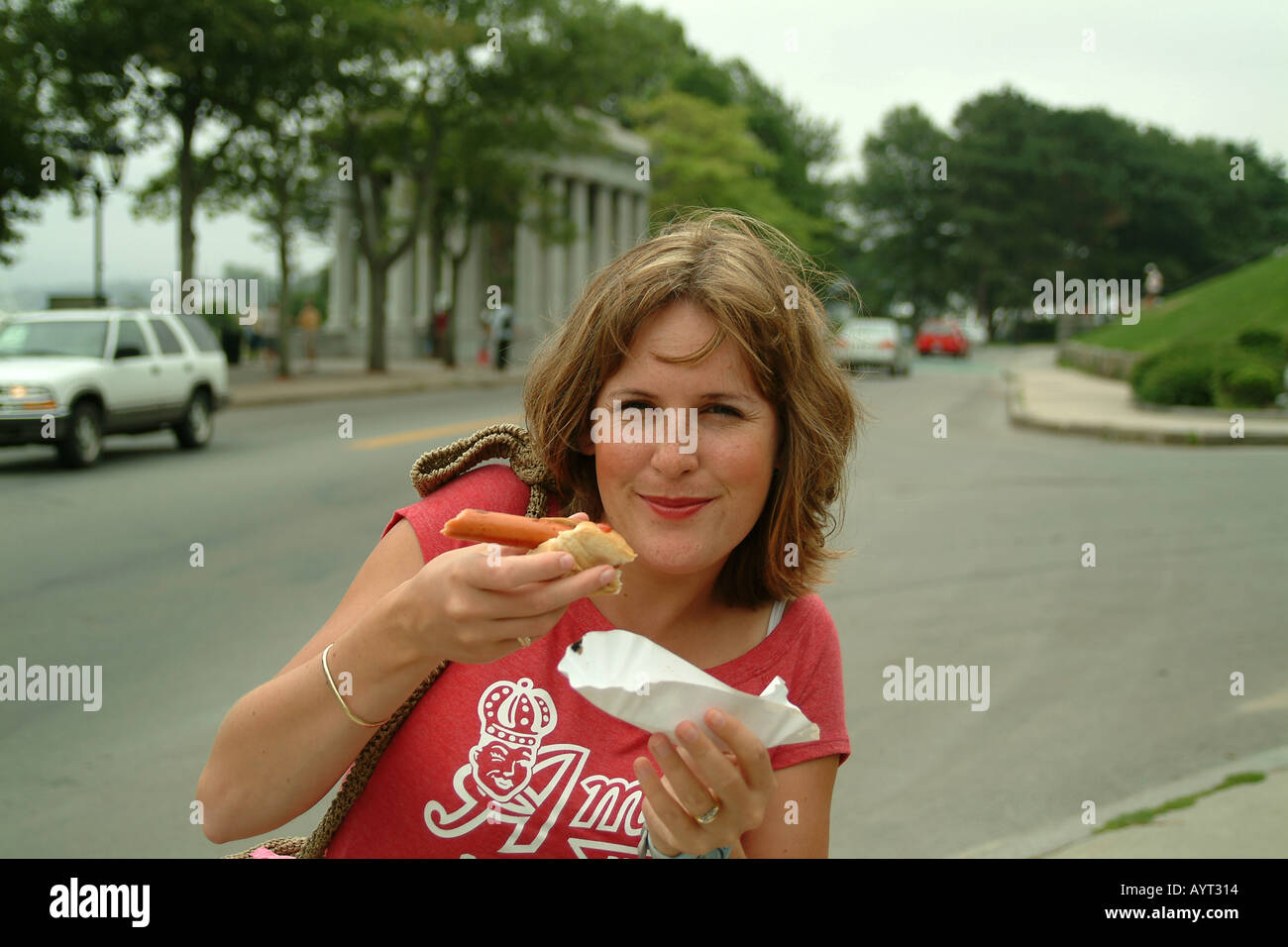 Girl eating a hotdog Plymouth Massachusetts MA USA Stock Photo