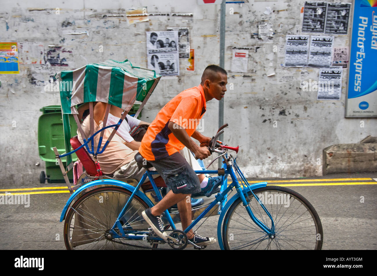 Pedicab on city street in Singapore Stock Photo
