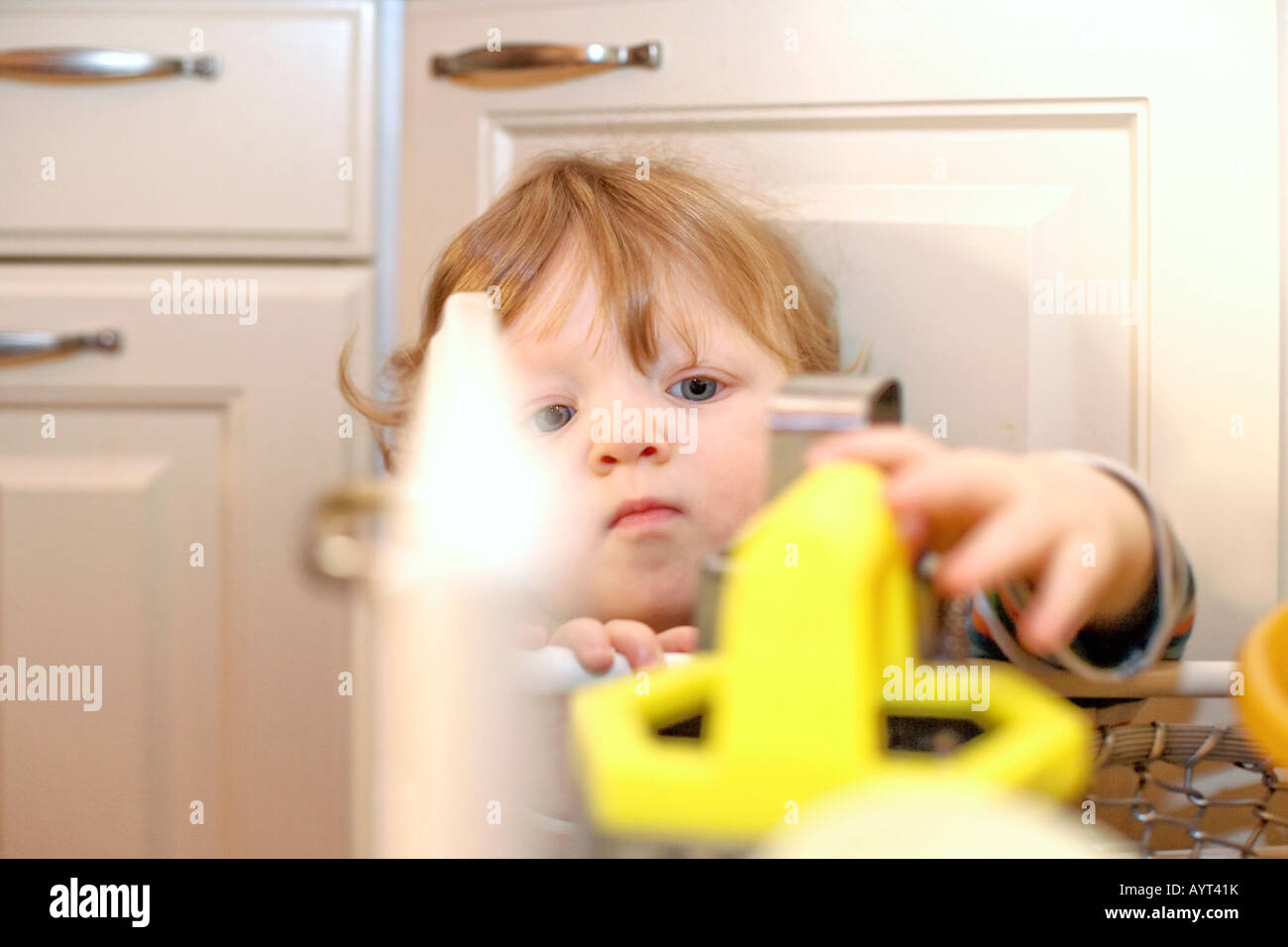 Boy Opening Drawer In The Kitchen Stock Photo 17174094 Alamy