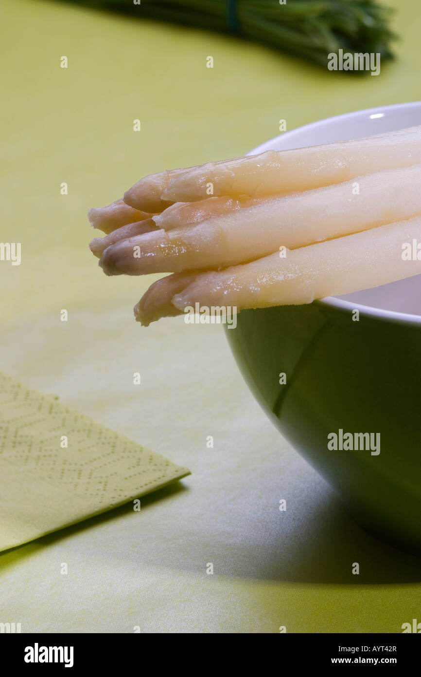 Boiled white asparagus laying on top of a bowl Stock Photo