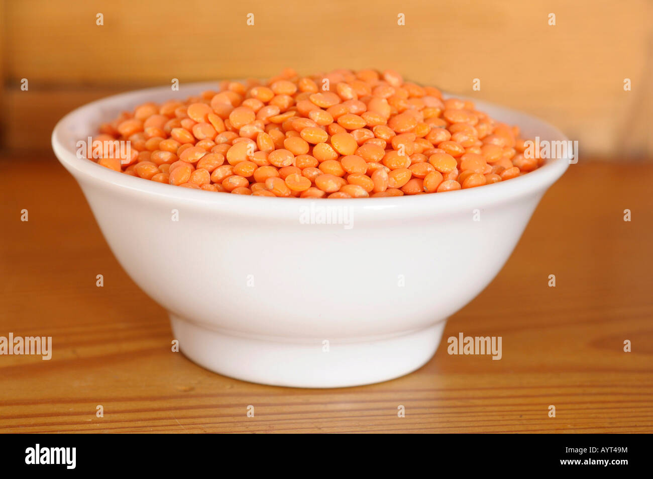 Red lentils (Lens esculenta) in a bowl Stock Photo