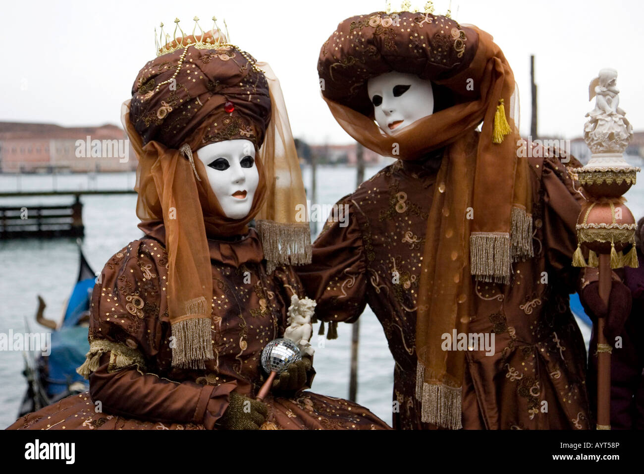 Two brown costumes and masks, Carnevale di Venezia, Carnival in Venice, Italy Stock Photo