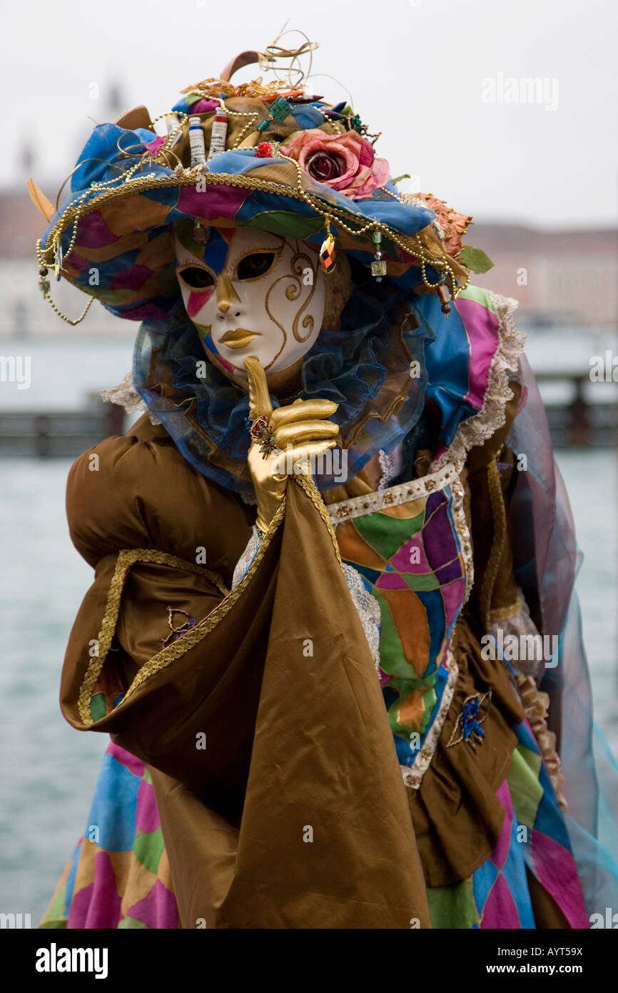 Colourful brown costume and mask, Carnevale di Venezia, Carneval in Venice, Italy Stock Photo