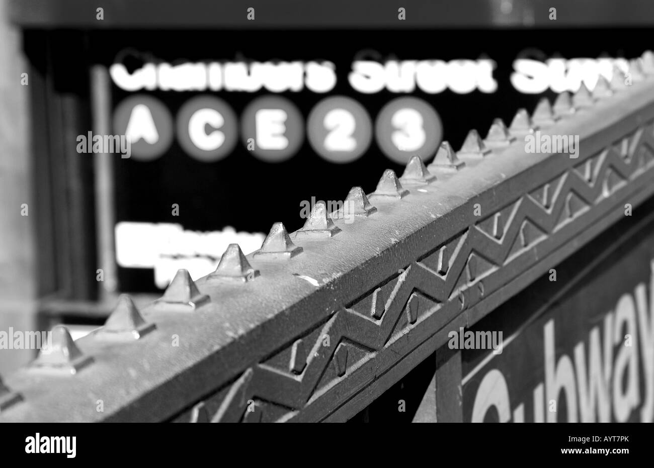 Spikes on subway railing in black and white Stock Photo - Alamy