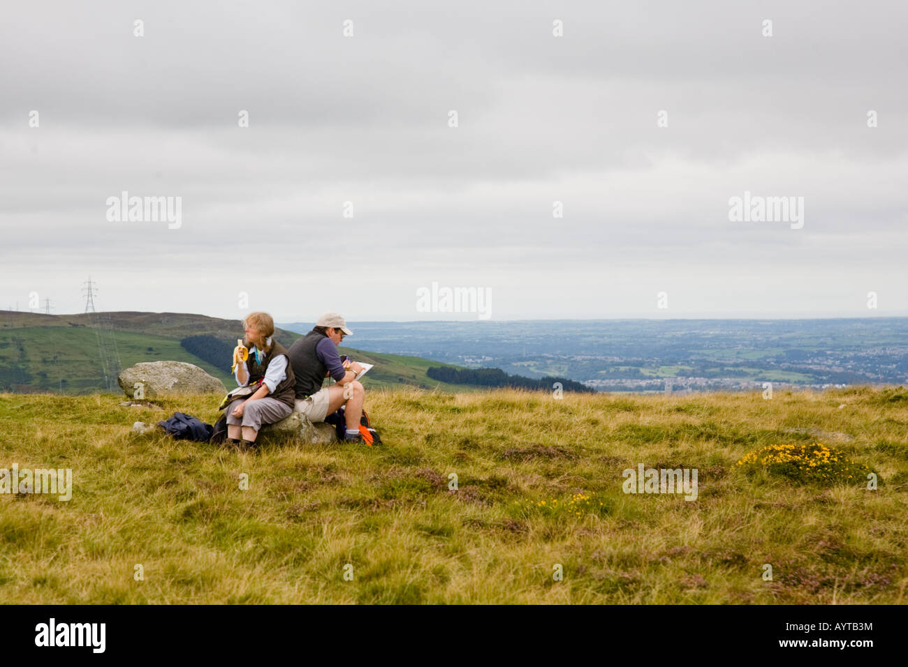 A couple of walkers stopped for a snack Stock Photo