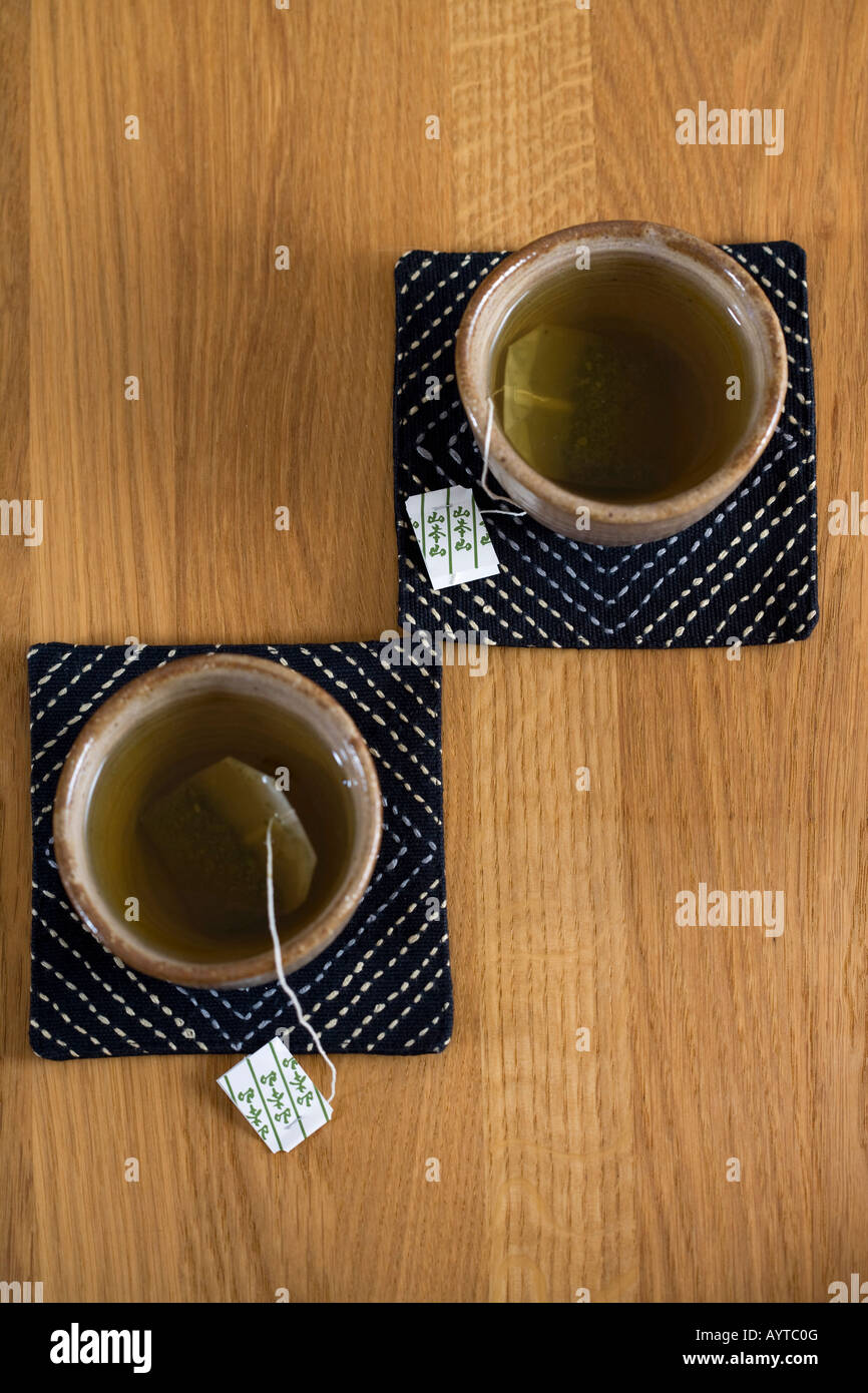 Two cups of tea and a tea bag Stock Photo Alamy
