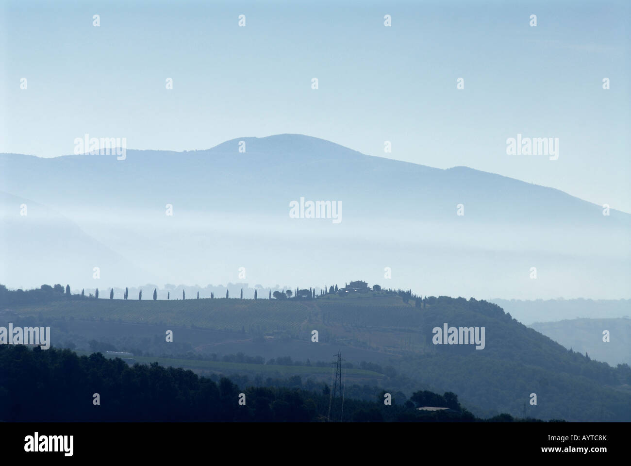 morning mist in the umbrian hills around todi italy Stock Photo