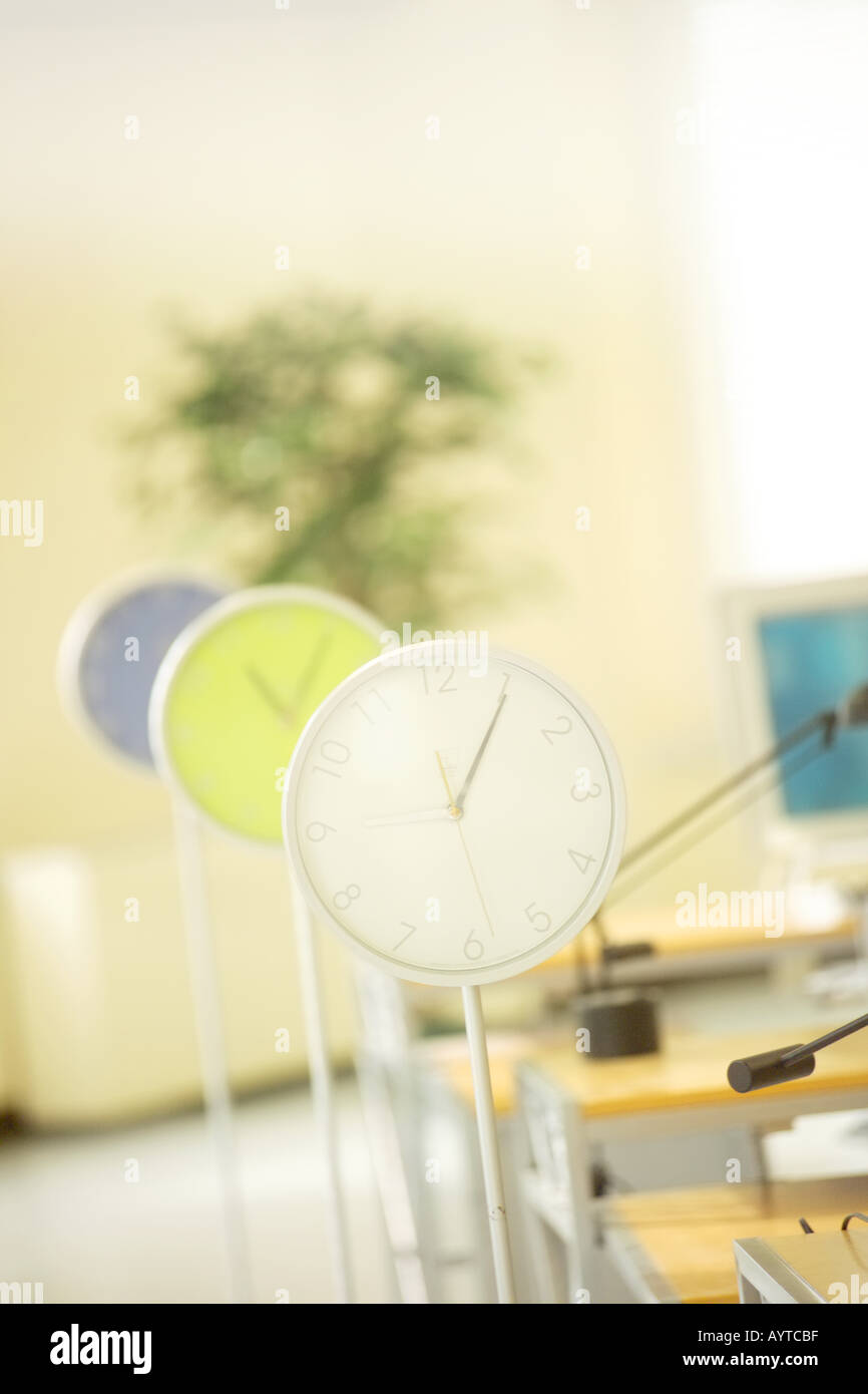 Three clocks showing different time Stock Photo - Alamy