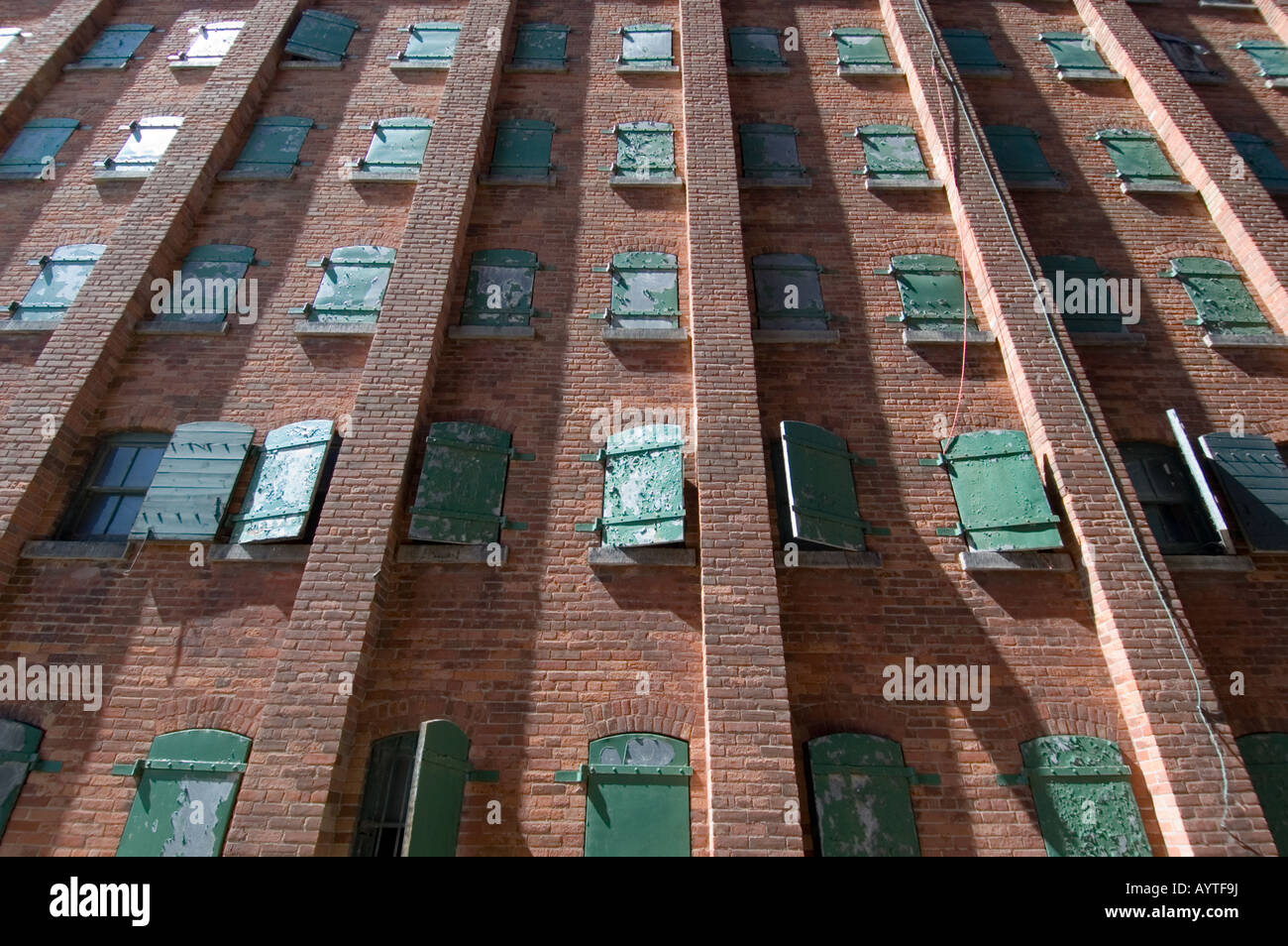 Shuttered windows in an old factory Stock Photo