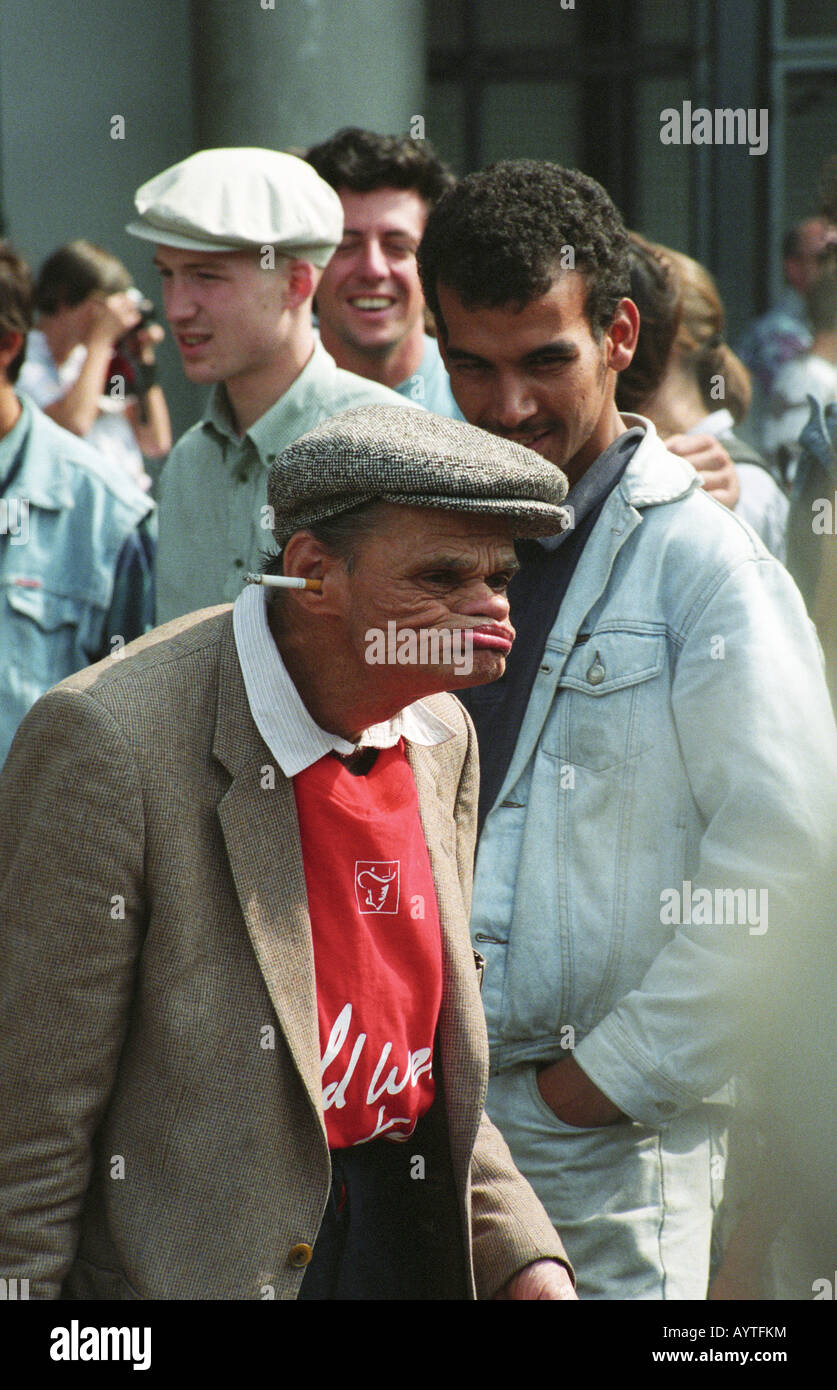 Man with a cigarette in his ear while gurning outside the Pompidou Centre in Paris 1993 Stock Photo