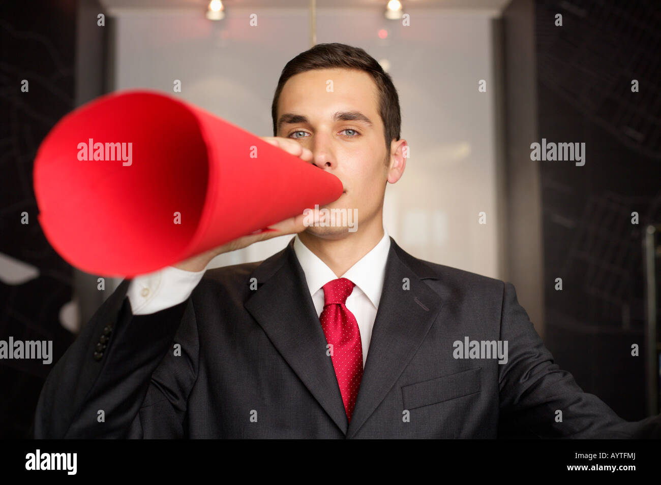 Businessman speaking through a megaphone Stock Photo Alamy