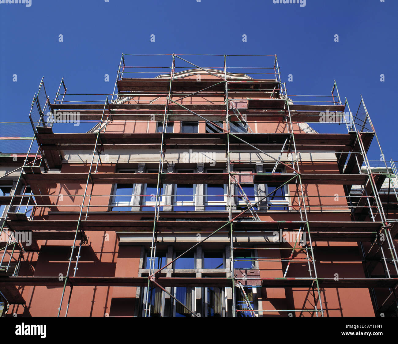 building with scaffold, house facade, construction works, building site ...