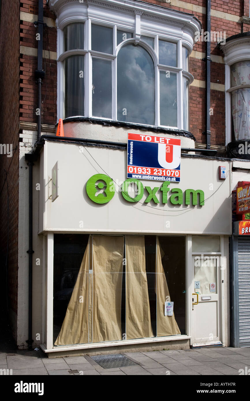 Closed down charity shop in high street Rushden England UK Stock Photo