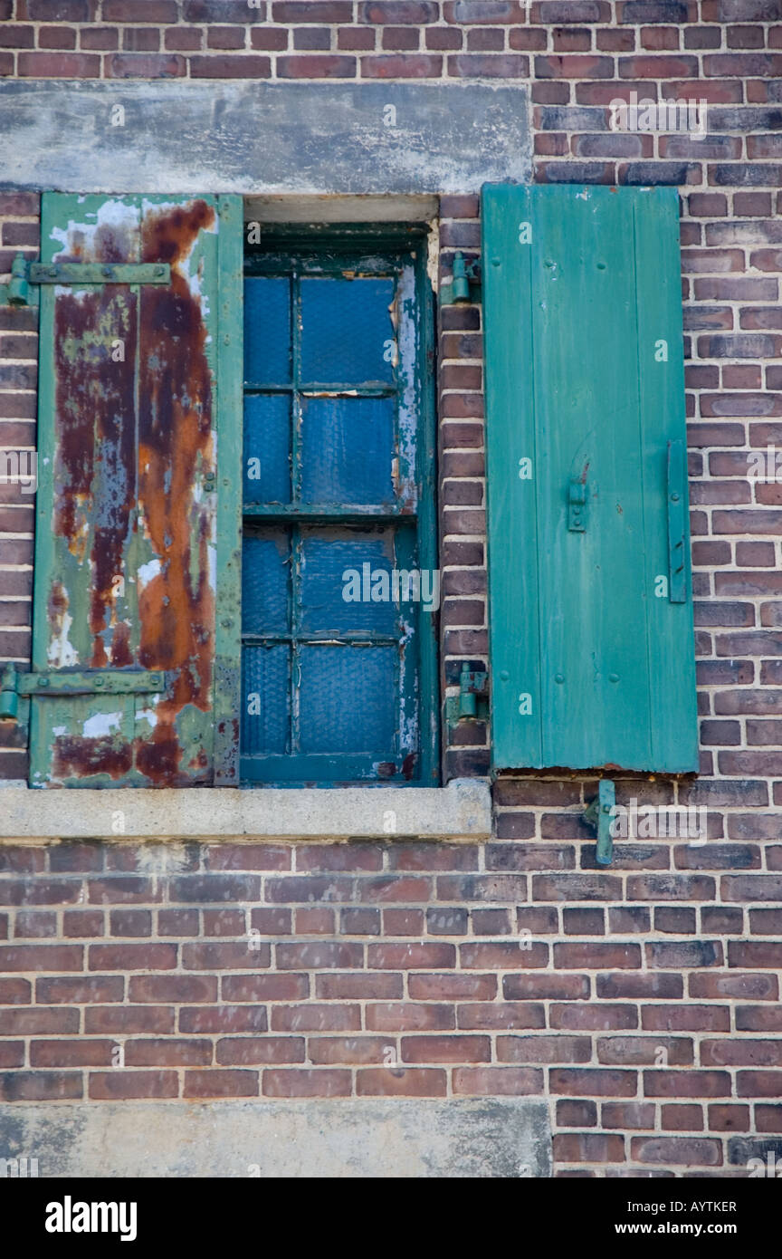 Shuttered window of old factory Stock Photo